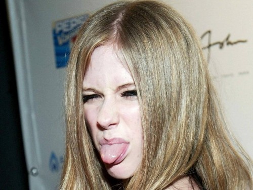 Avril Lavigne sticks out her tongue