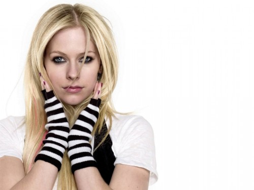 Avril Lavigne wears striped fingerless gloves