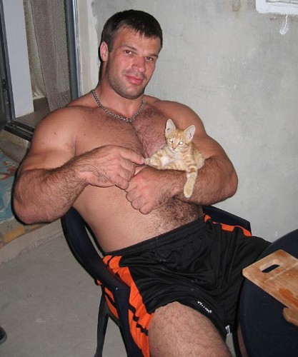 well build man with kitten