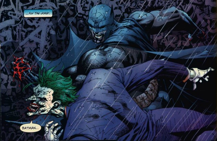 batman punches the joker