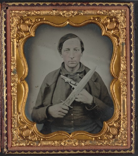 Unidentified soldier in Confederate uniform with knife and revolver