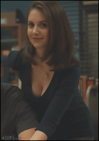 alision brie pulls her shirt down.gif
