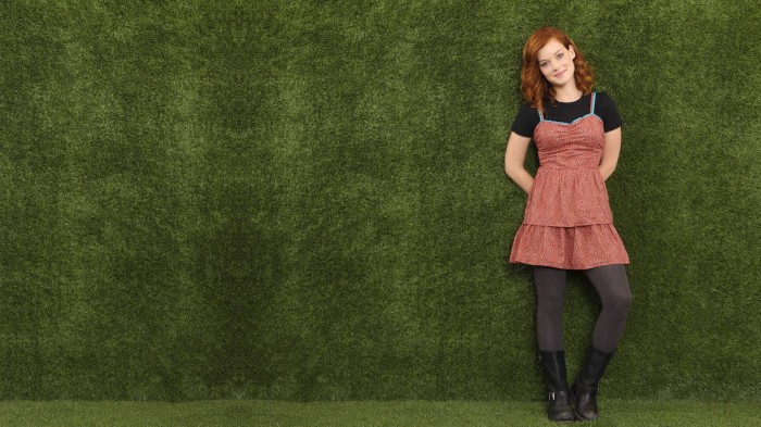 Emma on a green wall.jpg