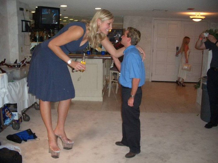 tall woman talking to short man.jpg