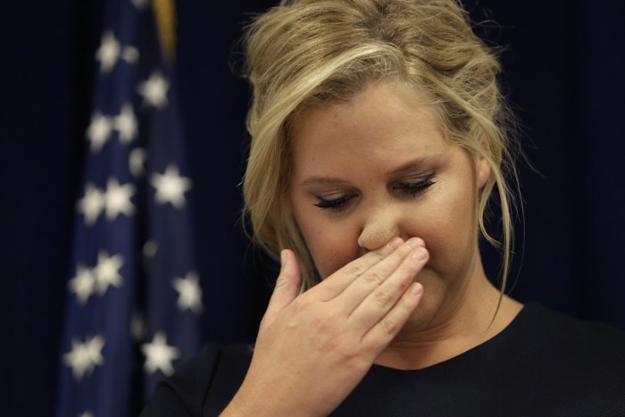 Amy Schumer wiping her pig nose.jpg