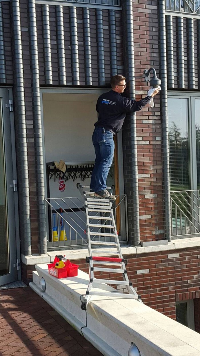 Using a ladder to change a bulb.jpg