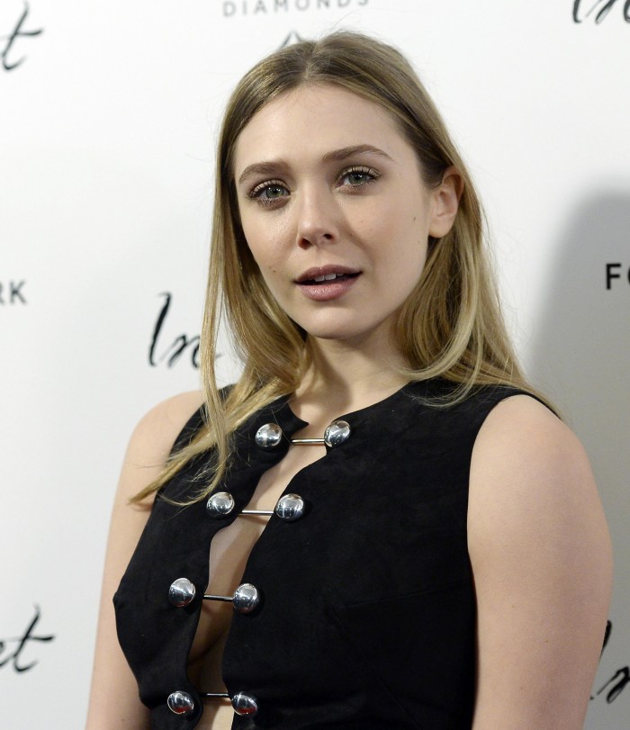 Elizabeth Olsen with her mouth open and her side boob.jpg