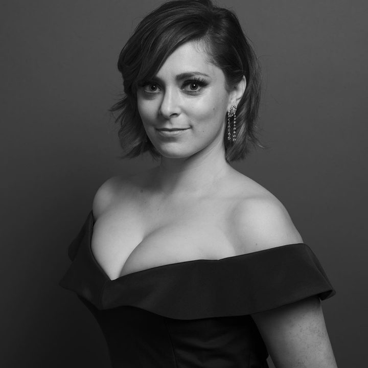 Rachel Bloom in a classy low cut black dress.jpg