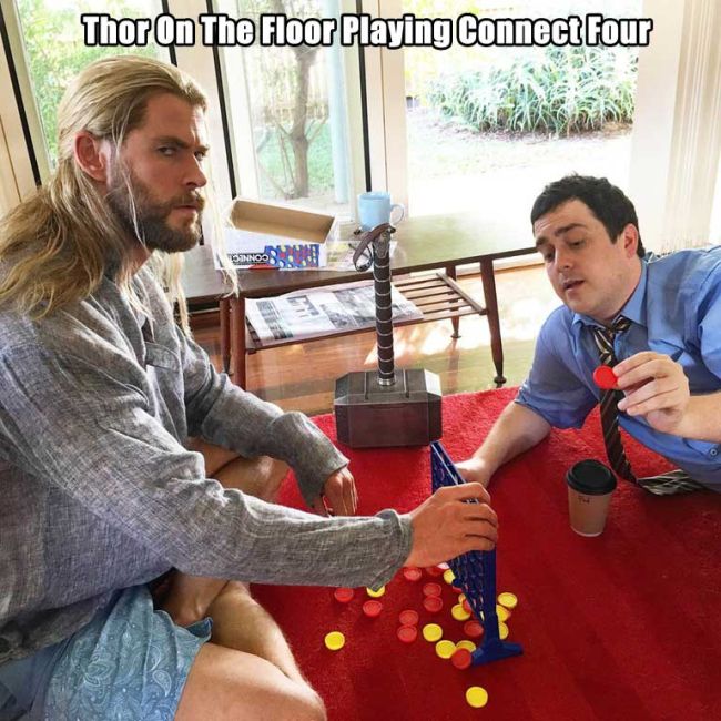 thor on the floor playing connect four.jpg