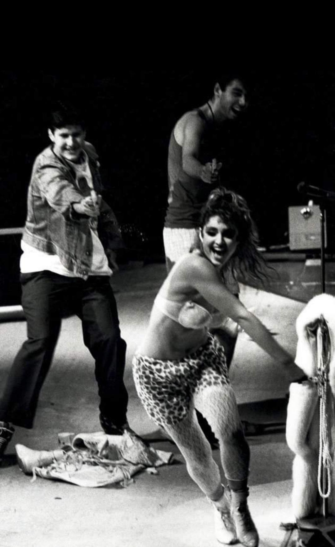 The Beastie Boys chasing Madonna with water guns on stage, 1985
