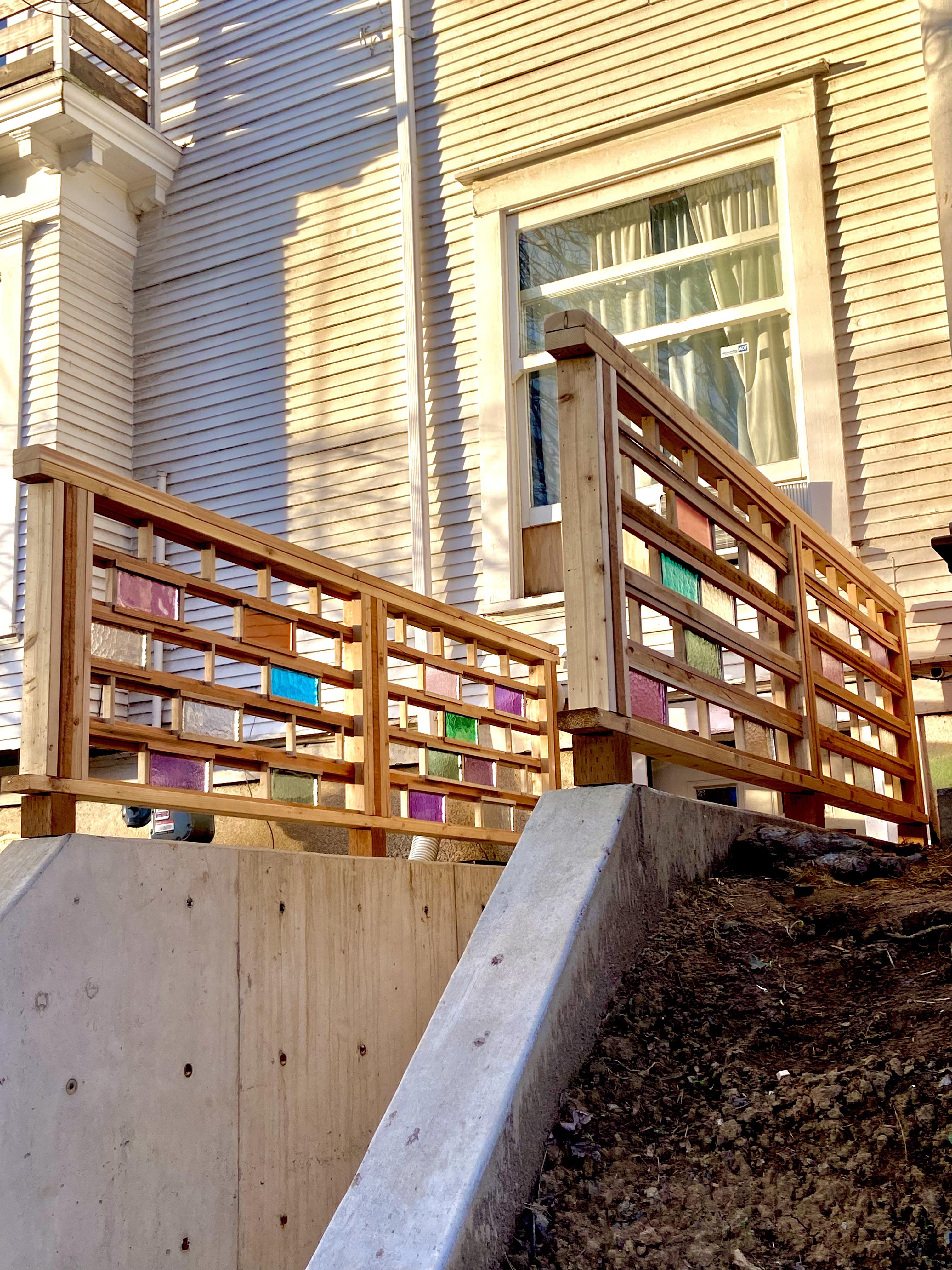 Wooden railings with stained-glass bricks - MyConfinedSpace